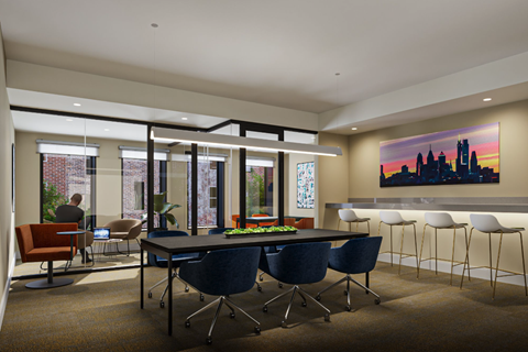 a dining room with a table and chairs and a painting on the wall